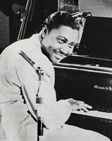 Early rock music artist Amos Milburn at piano