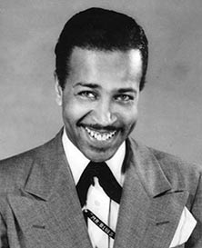 Early rock music artist Wynonie Harris smiling