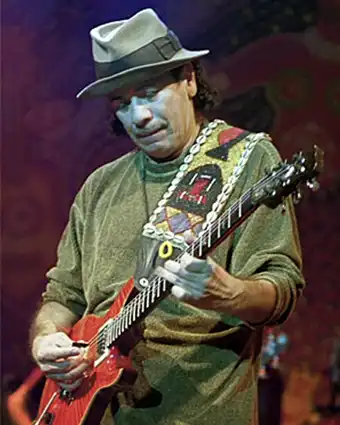 Latin rock guitarist Carlos Santana playing guitar