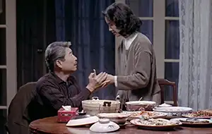 Dining scene with man and woman from the movie Eat Drink Man Woman