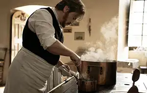 Kitchen scene from the movie The Taste of Things