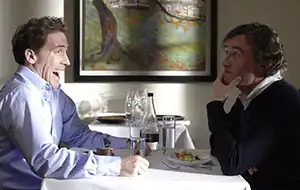 Steve Coogan and Rob Brydon at table from the movie The Trip