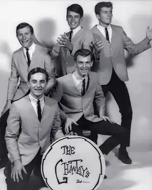 The Chantays posing in suits